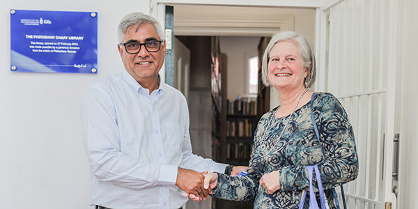 Professor Imraan Valodia and Anne Gordon celebrate the opening of the Phiroshaw Camay Library